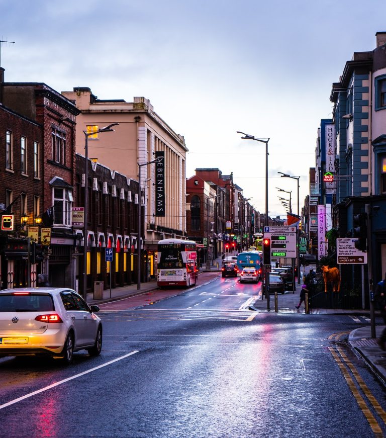 road, street scene, traffic, rain, wet, city, taxi, about, traffic light, traffic flow, pedestrian, crosswalk, in-street ped crossing, transport, advertising, urban, to travel, automobile, business, scene, nature, evening sky, limerick, ireland